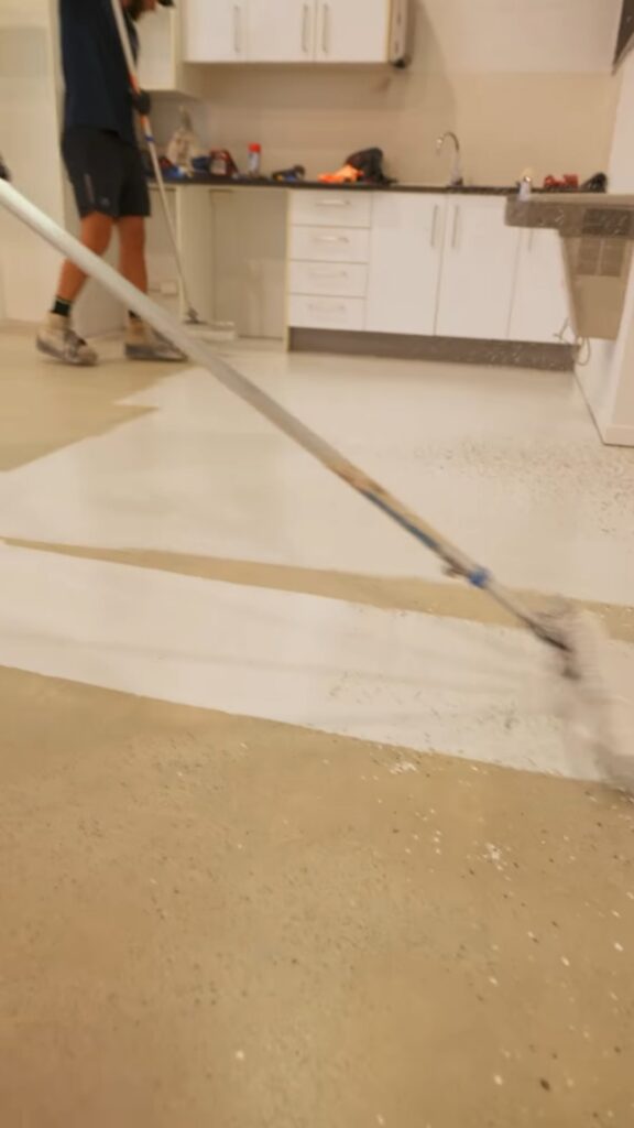 Rolling epoxy flake floor in a Gold Coast factory
