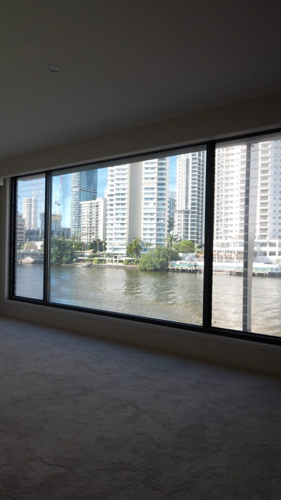 Finished bedroom with river views in a new build Surfers Paradise home painted by We Paint Gold Coast