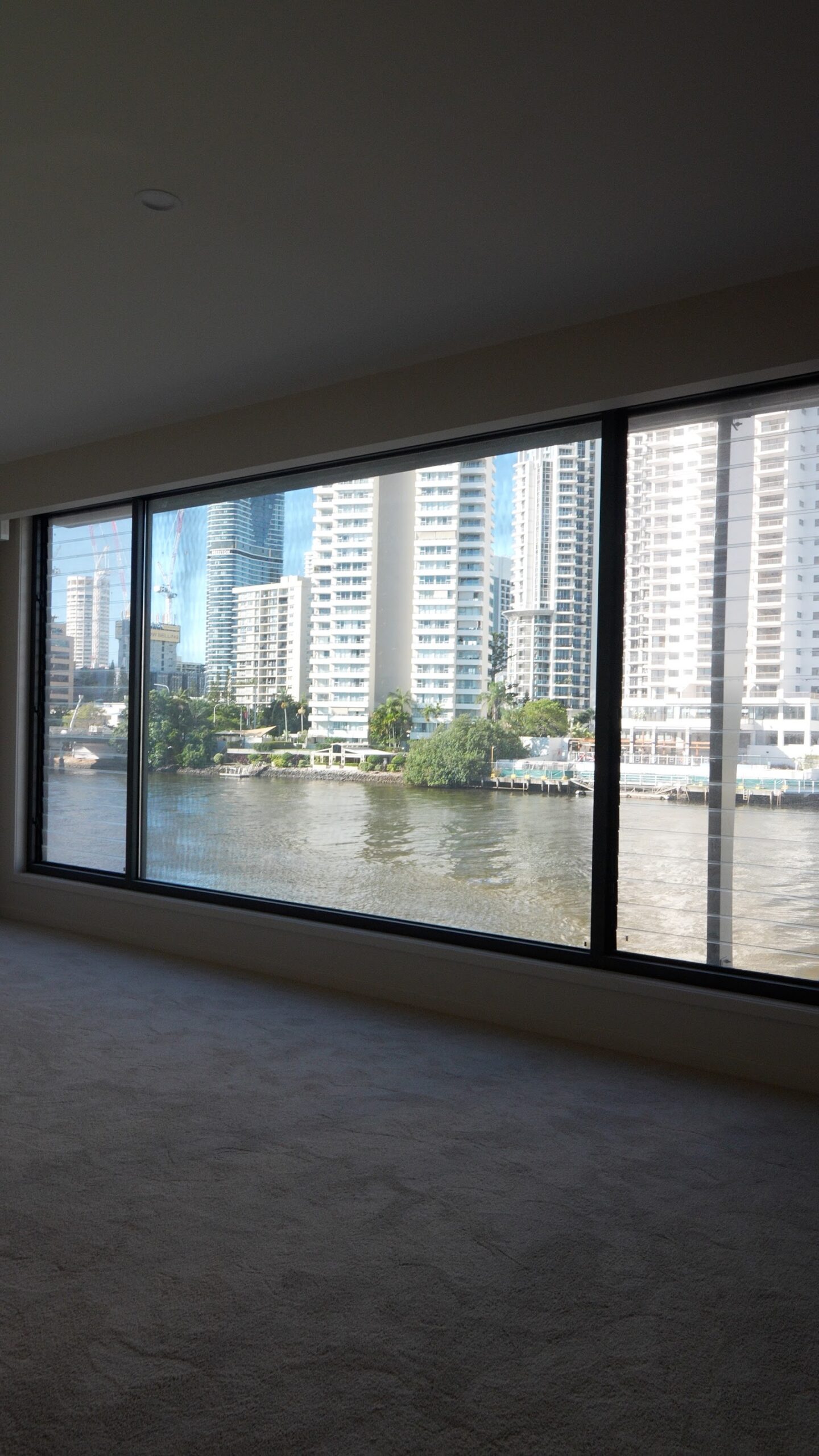 Finished bedroom with river views in a new build Surfers Paradise home painted by We Paint Gold Coast